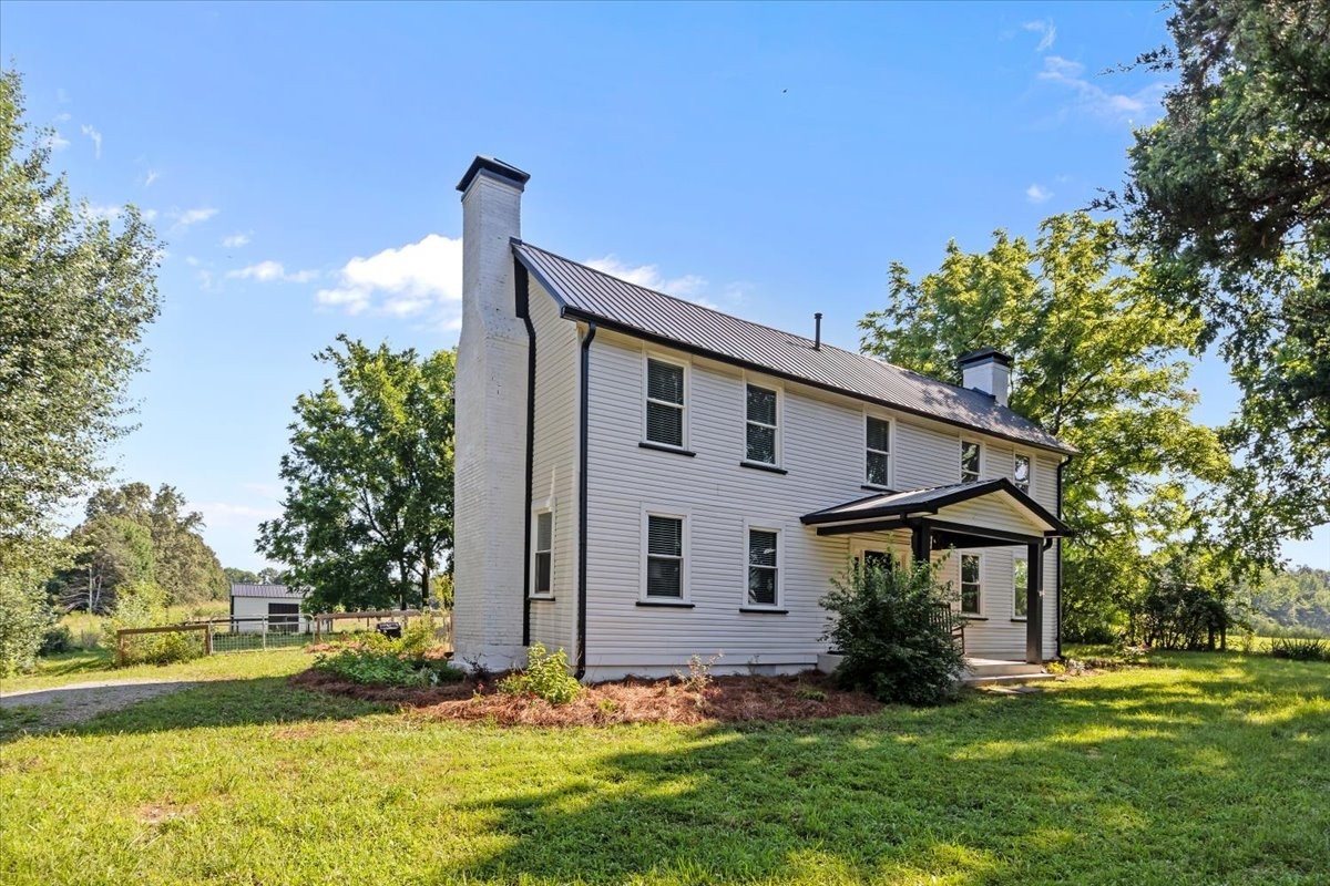 1030 Upper Creek Road Vanleer, TN 37181 - Photo 34 of 38 a front view of a house with garden