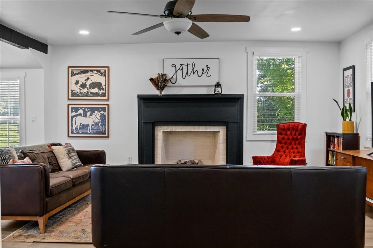 1030 Upper Creek Road Vanleer, TN 37181 - Photo 4 of 38 a living room with furniture a large window and a fireplace