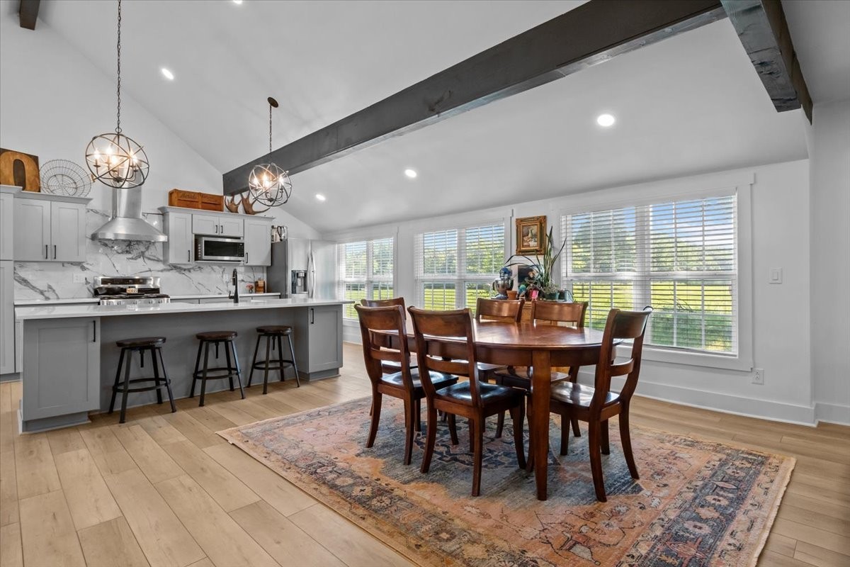 1030 Upper Creek Road Vanleer, TN 37181 - Photo 8 of 38 a view of a dining room with furniture window and wooden floor