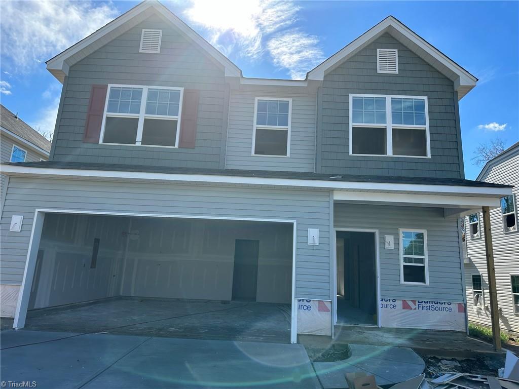 3256 Alyssa Way High Point, NC 27265 - Photo 2 of 26 Stone wainscot to be installed, garage door with windows & decorative hardware
