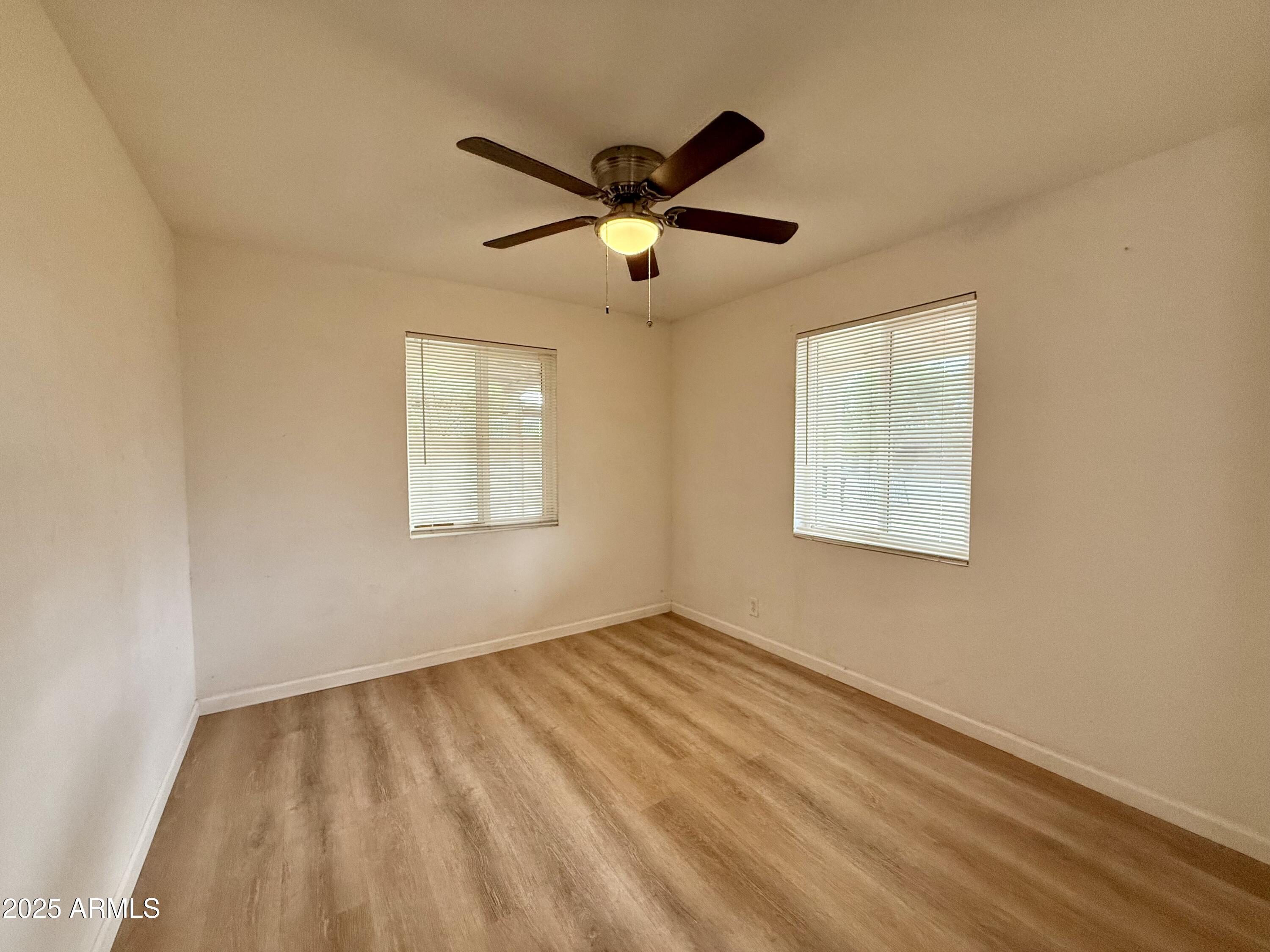 1218 West Cinnabar Avenue Phoenix, AZ 85021 - Photo 11 of 31 a view of an empty room with a window