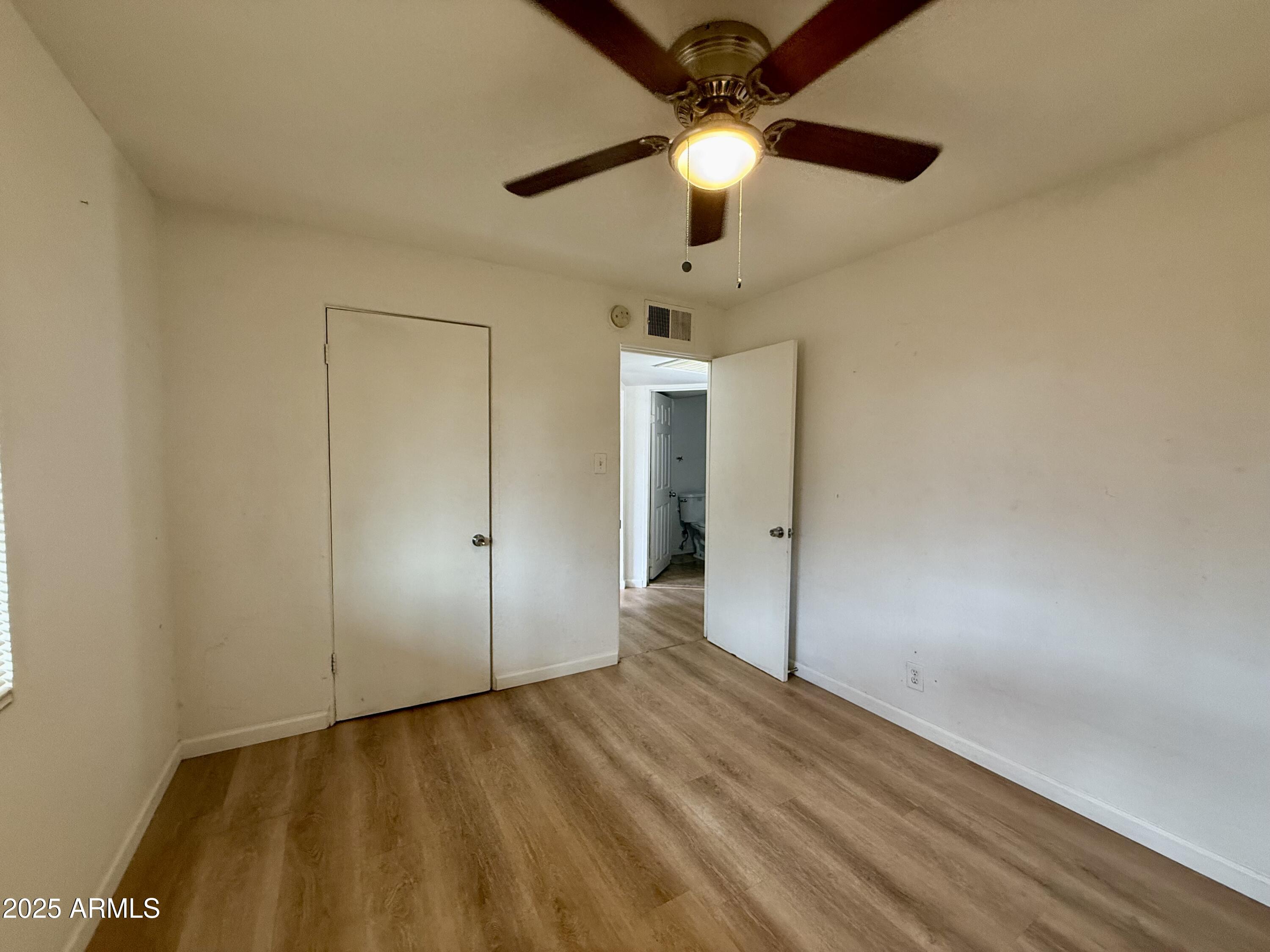 1218 West Cinnabar Avenue Phoenix, AZ 85021 - Photo 12 of 31 wooden floor in an empty room