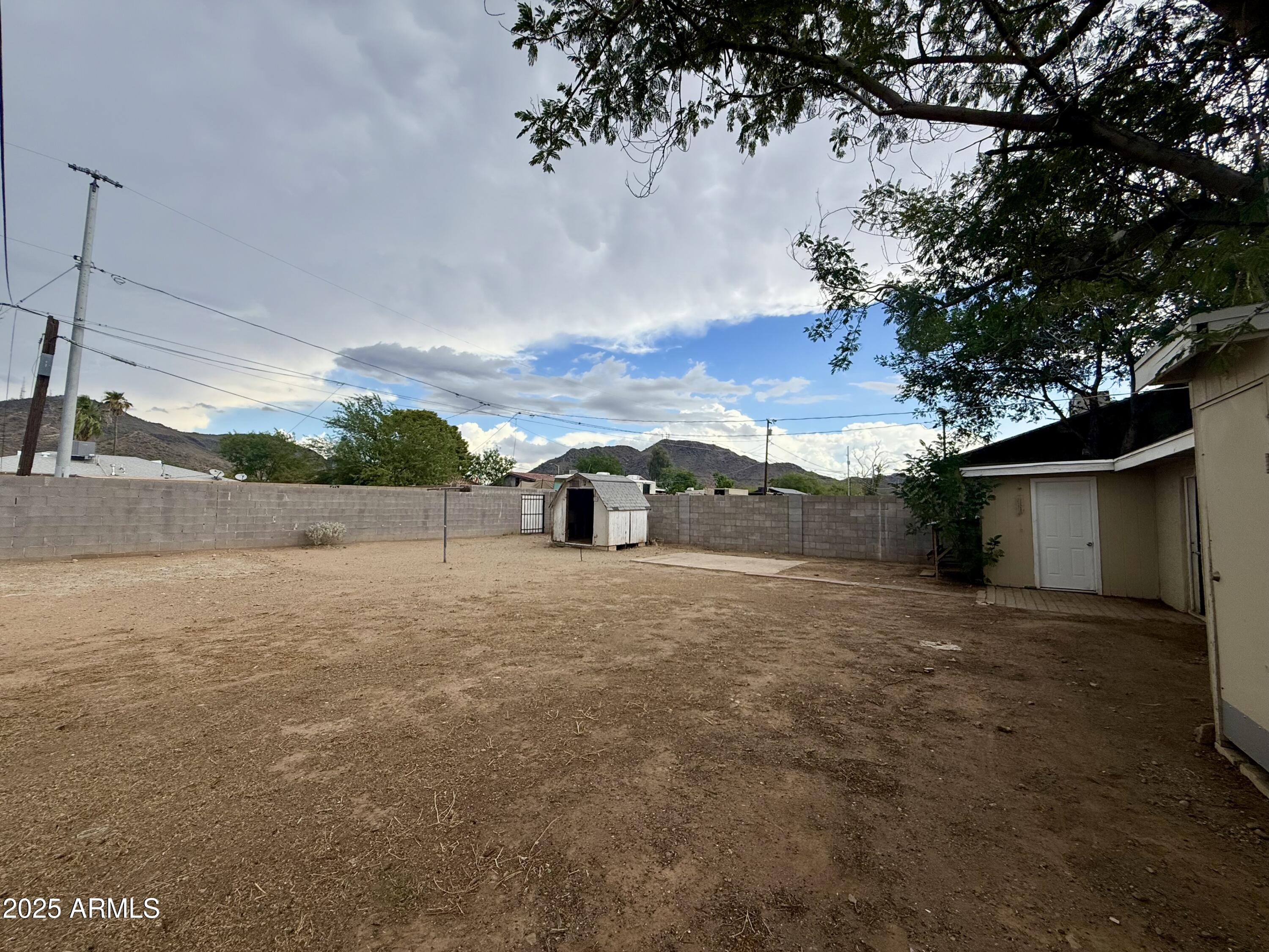 1218 West Cinnabar Avenue Phoenix, AZ 85021 - Photo 27 of 31 a road view with large trees