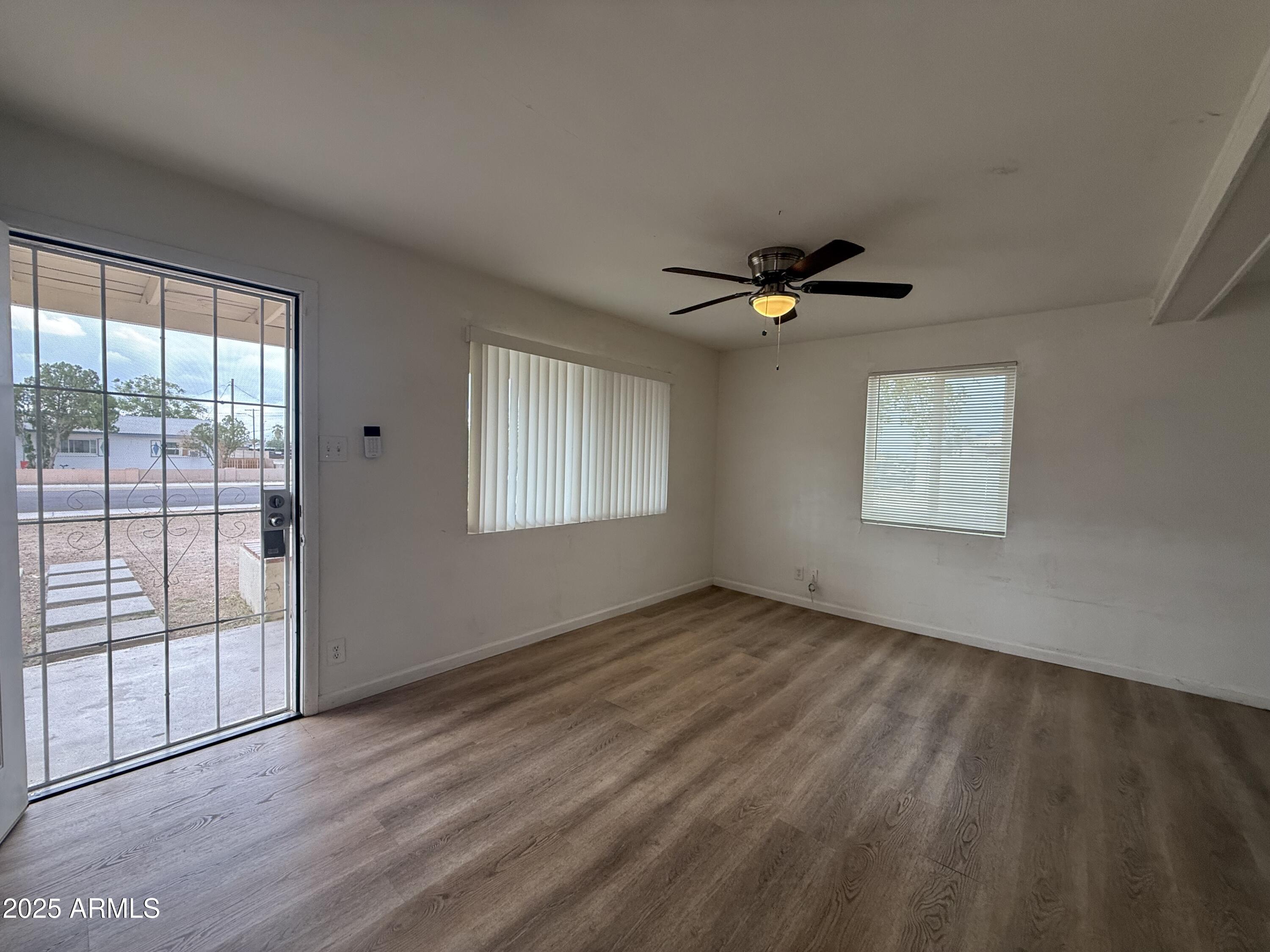 1218 West Cinnabar Avenue Phoenix, AZ 85021 - Photo 8 of 31 a view of an empty room with a window