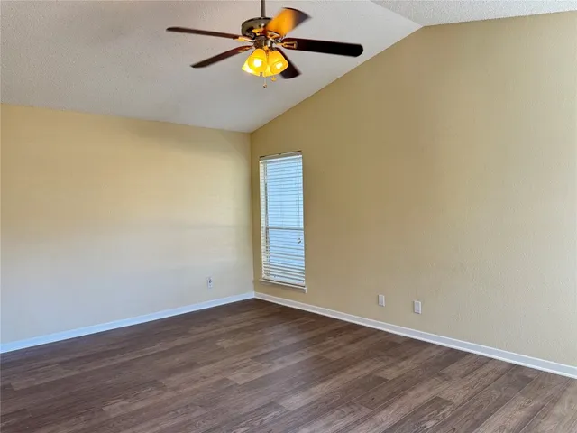 a bathroom with a granite countertop sink a toilet and bathtub