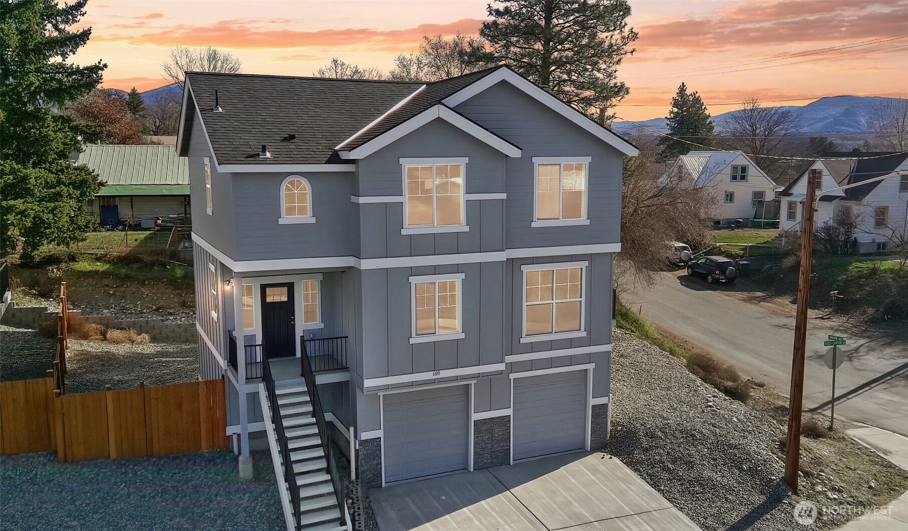 a front view of a house with parking area