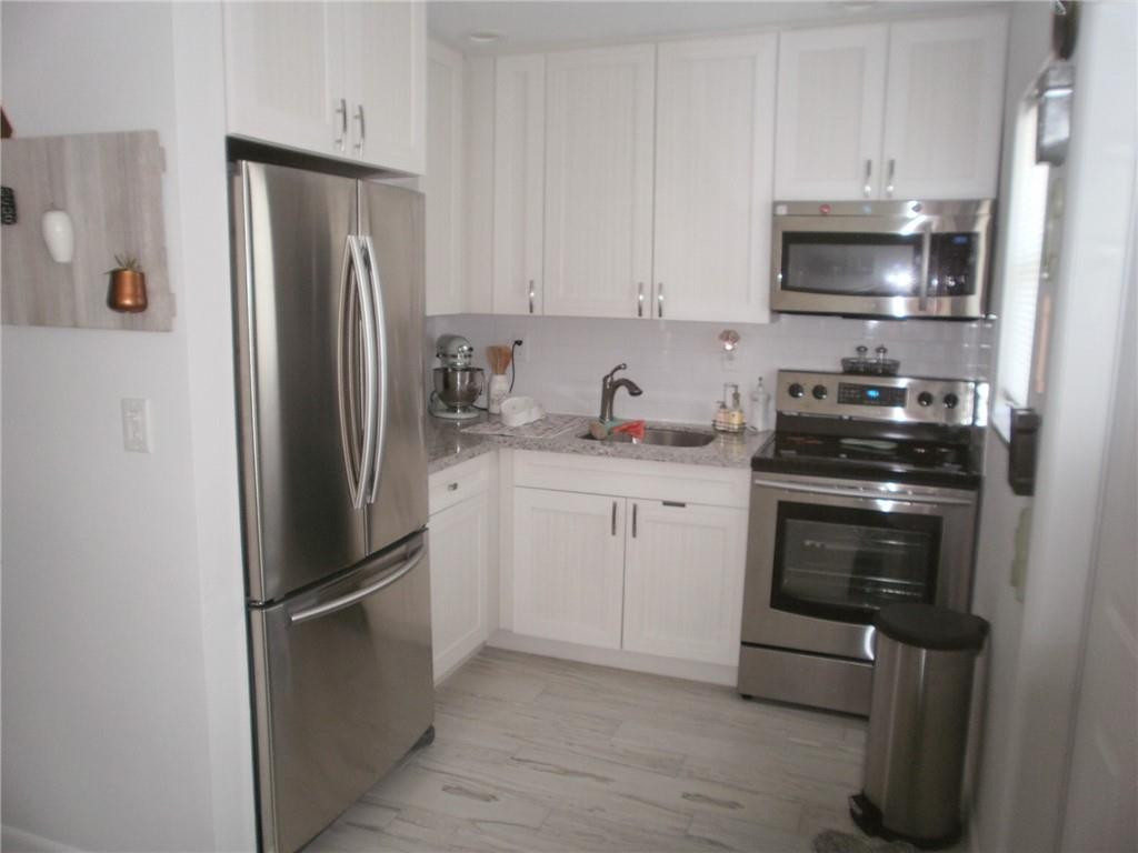 Undisclosed Address Lighthouse Point, FL 33064 - Photo 3 of 19 New cabinets and recessed lighting!