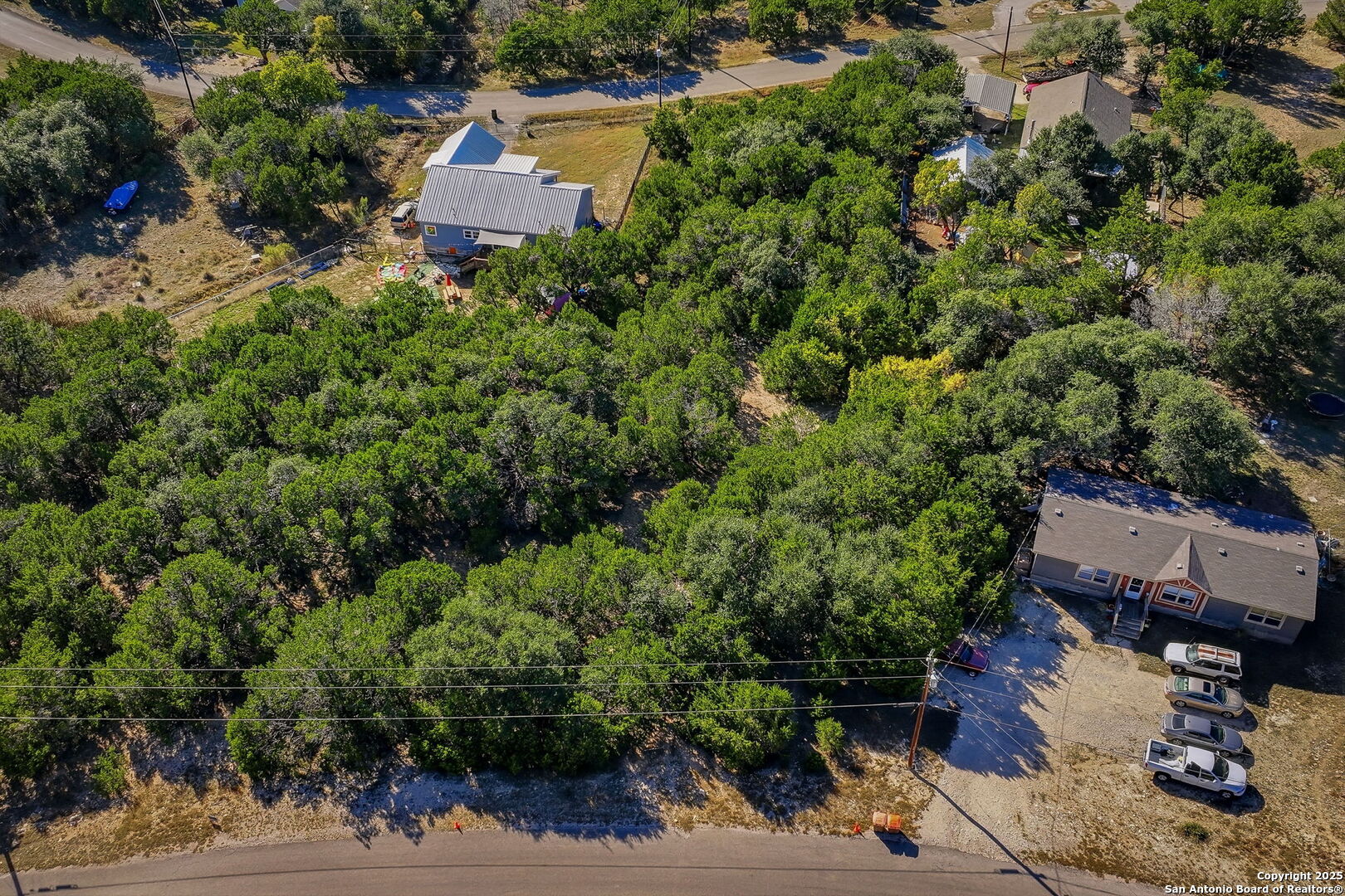 354 Buck Run Pass Canyon Lake, TX 78133 - Photo 11 of 16 an aerial view of a house with a yard and lake view