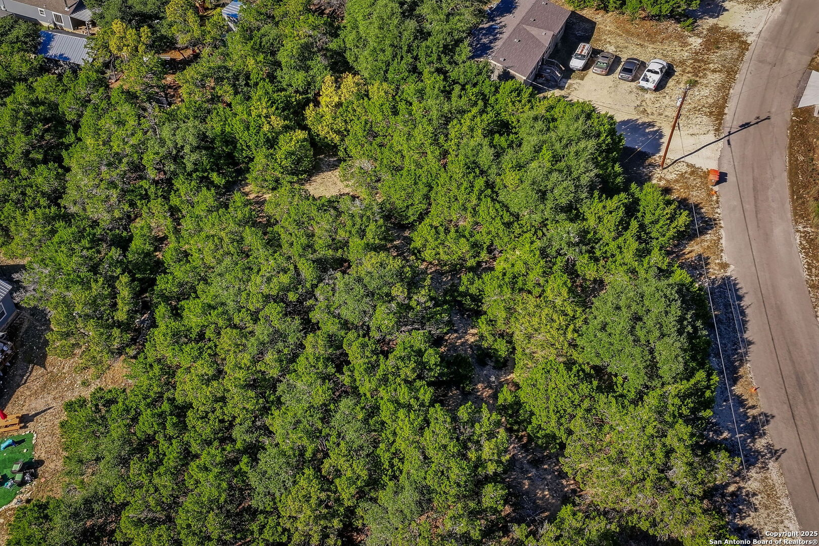 354 Buck Run Pass Canyon Lake, TX 78133 - Photo 10 of 16 an aerial view of a house with a yard