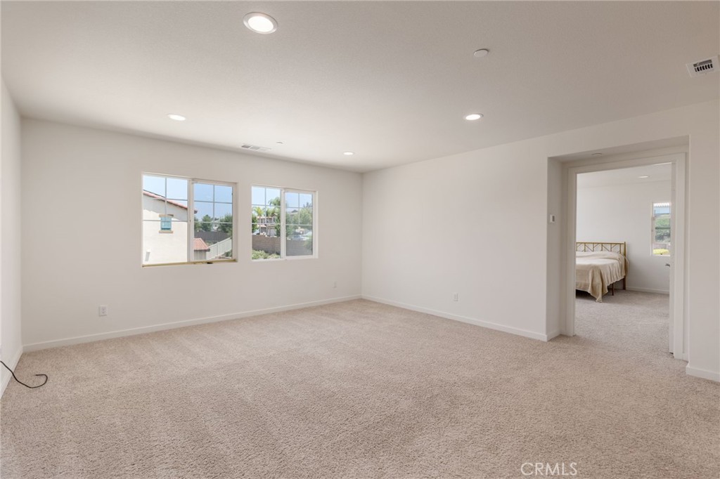 31124 Hanover Lane Menifee, CA 92584 - Photo 11 of 39 an empty room with a bathroom and a window