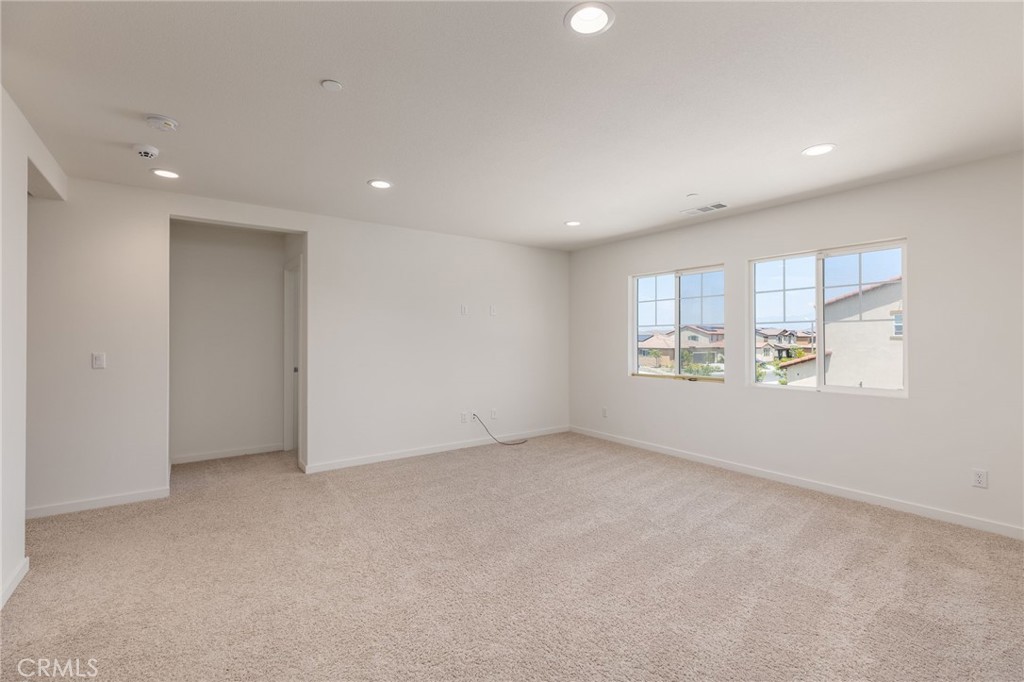 31124 Hanover Lane Menifee, CA 92584 - Photo 13 of 39 a view of an empty room with a window