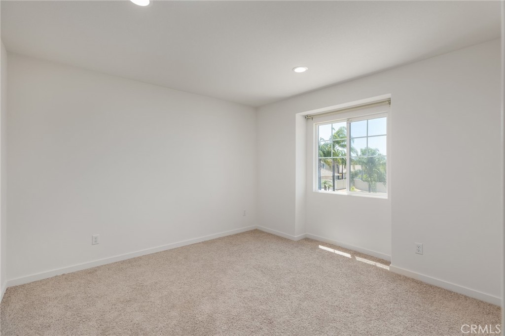 31124 Hanover Lane Menifee, CA 92584 - Photo 21 of 39 an empty room with windows