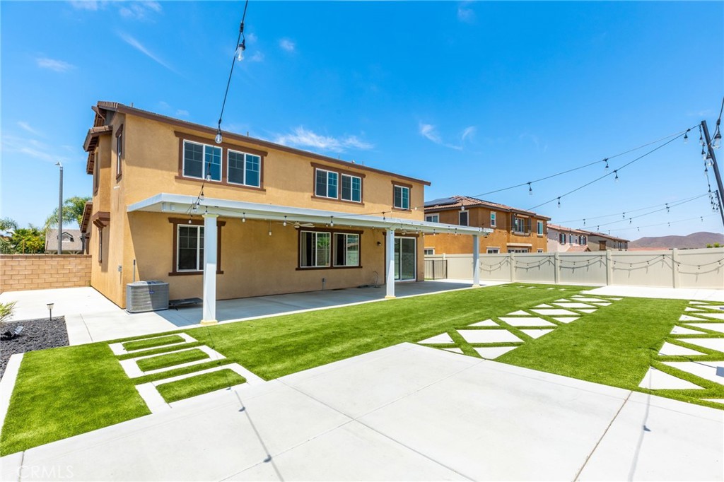 31124 Hanover Lane Menifee, CA 92584 - Photo 28 of 39 a front view of a house with a yard