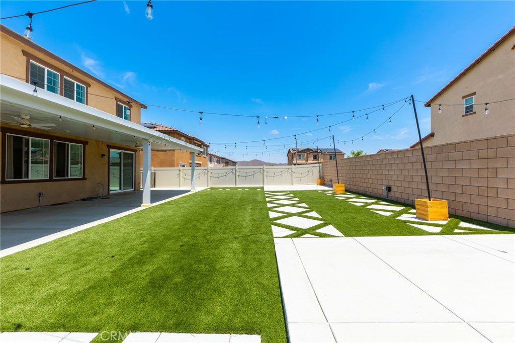31124 Hanover Lane Menifee, CA 92584 - Photo 30 of 39 a view of a house with backyard and sitting area