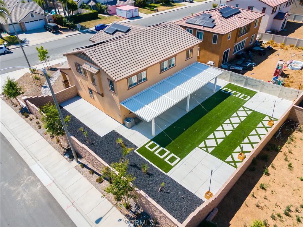 31124 Hanover Lane Menifee, CA 92584 - Photo 32 of 39 an aerial view of a house with a garden and pool
