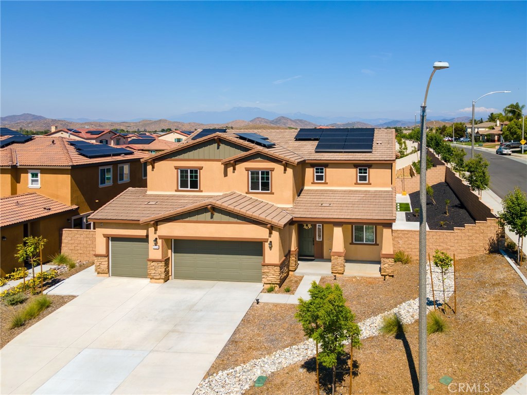 31124 Hanover Lane Menifee, CA 92584 - Photo 37 of 39 a front view of a house with a yard