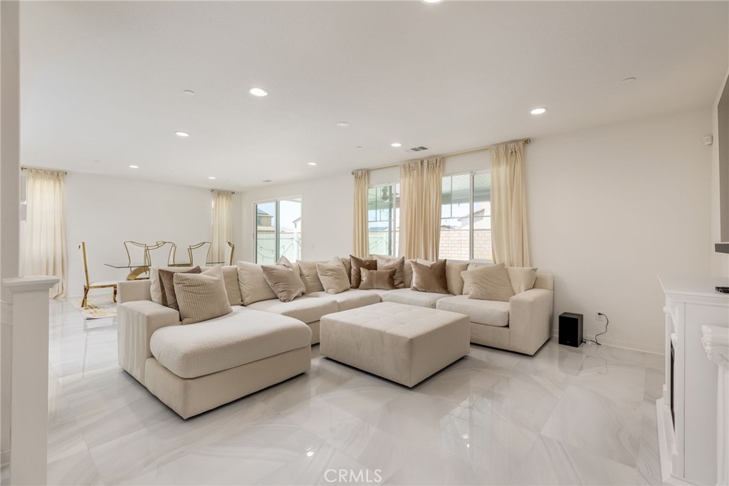 31124 Hanover Lane Menifee, CA 92584 - Photo 4 of 39 a living room with furniture and a large window