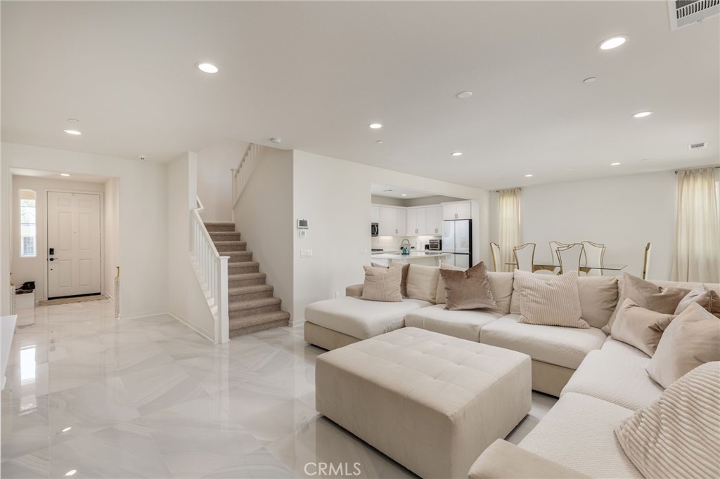 31124 Hanover Lane Menifee, CA 92584 - Photo 5 of 39 a living room with furniture and a ceiling fan
