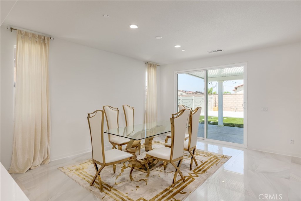 31124 Hanover Lane Menifee, CA 92584 - Photo 7 of 39 a view of a dining room with furniture window and outside view