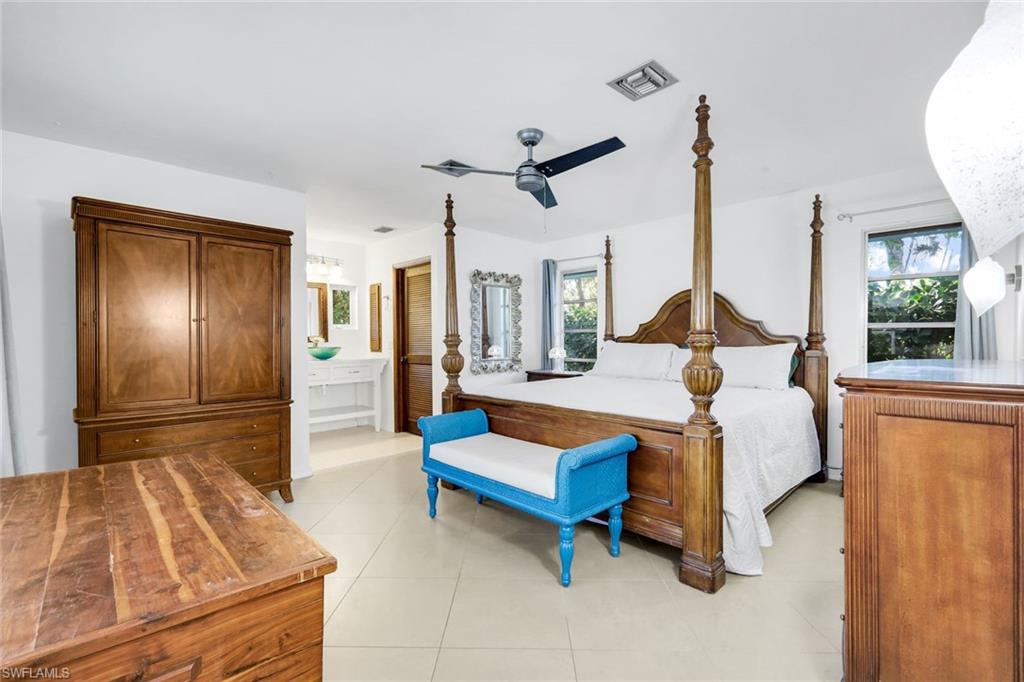 4352 Parrot Avenue Naples, FL 34104 - Photo 13 of 27 a bed room with a bed and window