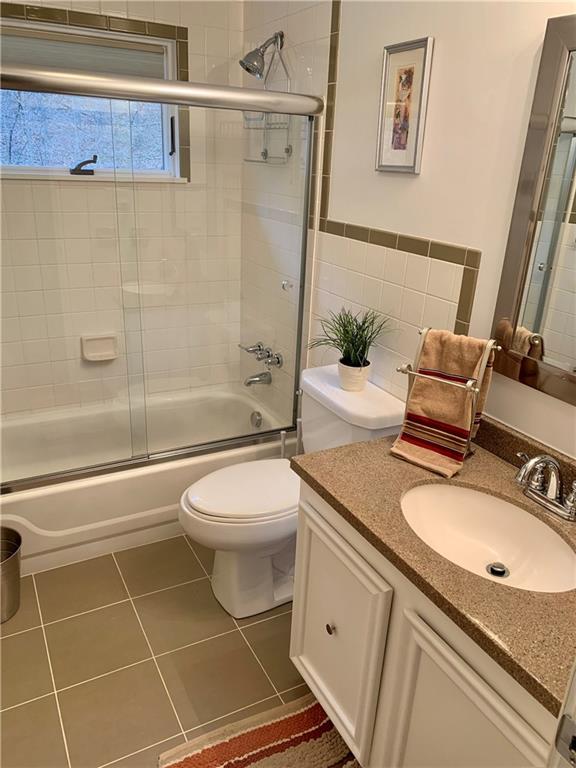 1708 Dime Road Vandergrift, PA 15690 - Photo 12 of 25 a bathroom with a granite countertop sink toilet and shower