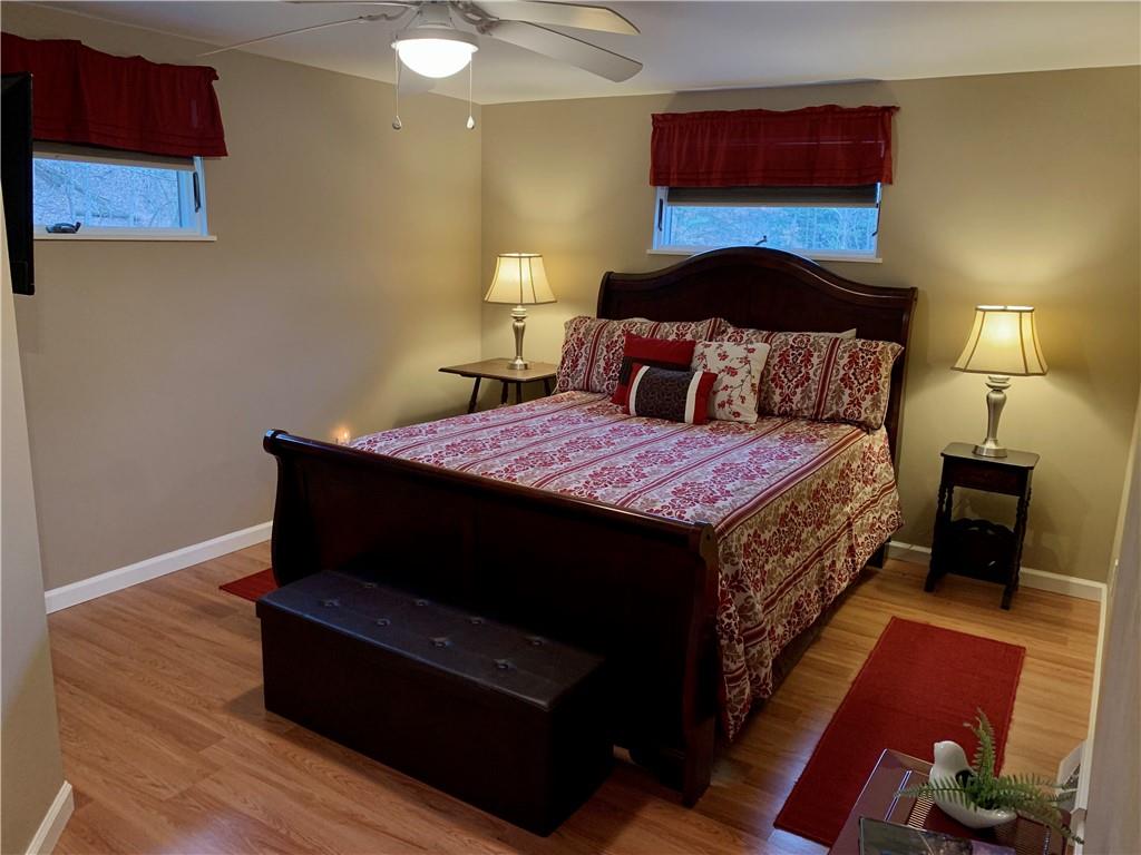 1708 Dime Road Vandergrift, PA 15690 - Photo 13 of 25 a bedroom with a bed and a lamp