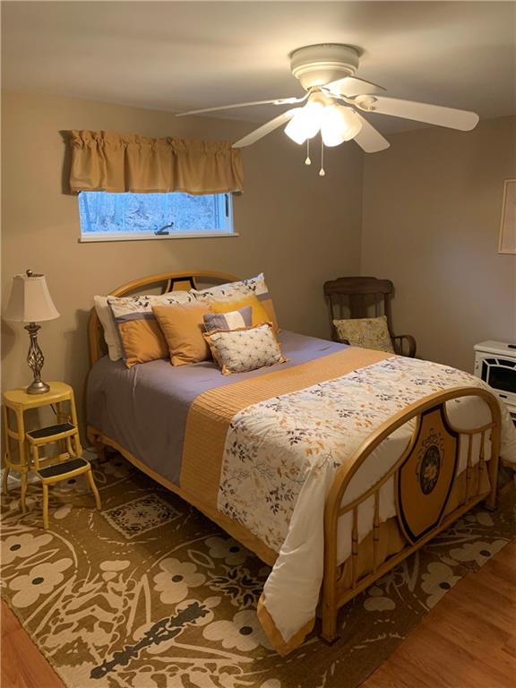 1708 Dime Road Vandergrift, PA 15690 - Photo 17 of 25 a bedroom with a bed and a chandelier