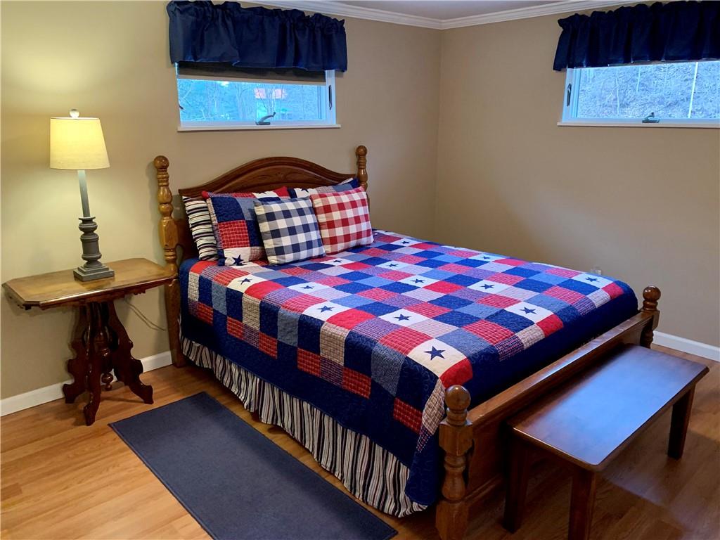 1708 Dime Road Vandergrift, PA 15690 - Photo 18 of 25 a bedroom with a bed a dresser and a lamp