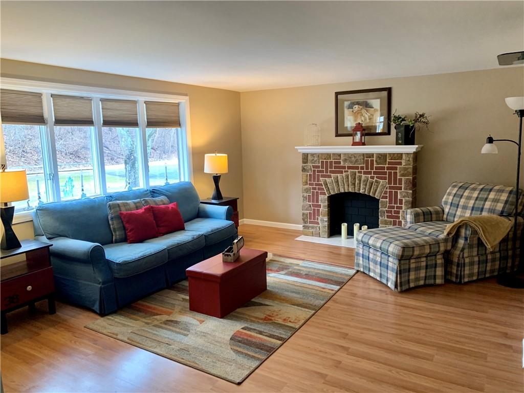 1708 Dime Road Vandergrift, PA 15690 - Photo 6 of 25 a living room with furniture and a fireplace