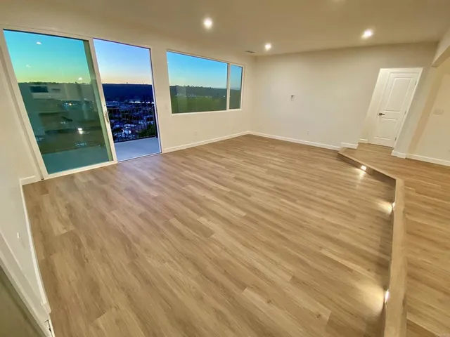 a view of an empty room with a bathroom
