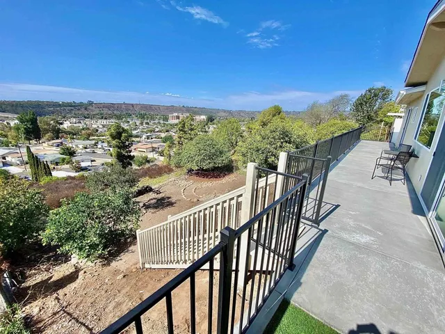 a view of a balcony with an outdoor space