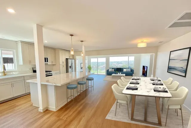 a view of a dining room with furniture window and wooden floor