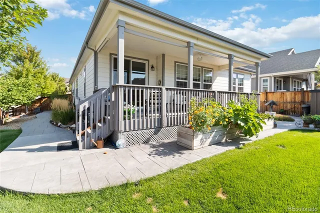 a bunch of flowers in front of building