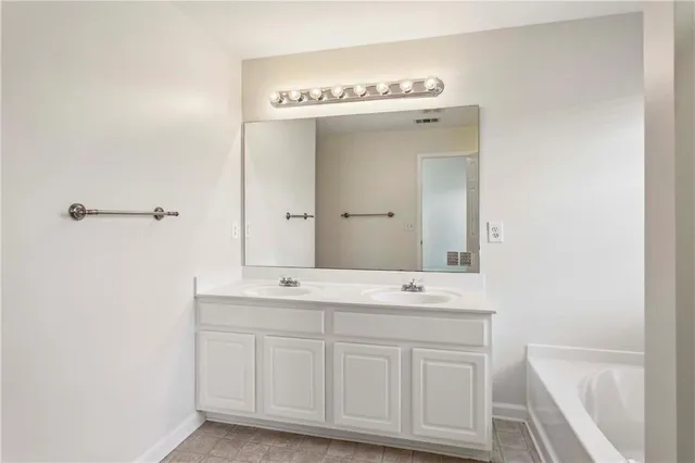 a bathroom with a bathtub and shower