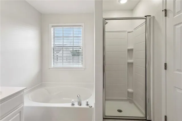 a white bath tub sitting next to a window