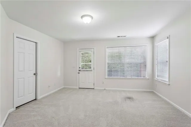 a storage room with wooden walls and a window