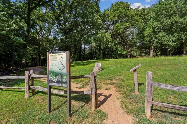 a front view of a house with a yard and a garage