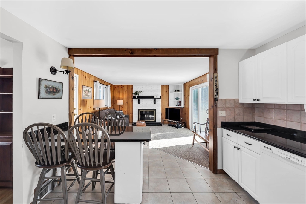 21 Martin Farms Road Hampden, MA 01036 - Photo 11 of 42 a kitchen with granite countertop a table and chairs