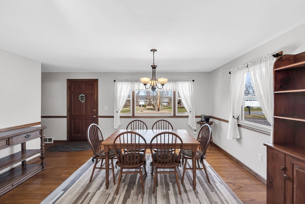 21 Martin Farms Road Hampden, MA 01036 - Photo 12 of 42 a view of a dining room with furniture window and wooden floor