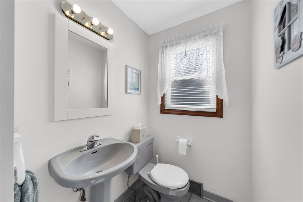 21 Martin Farms Road Hampden, MA 01036 - Photo 14 of 42 a bathroom with a toilet a sink and mirror