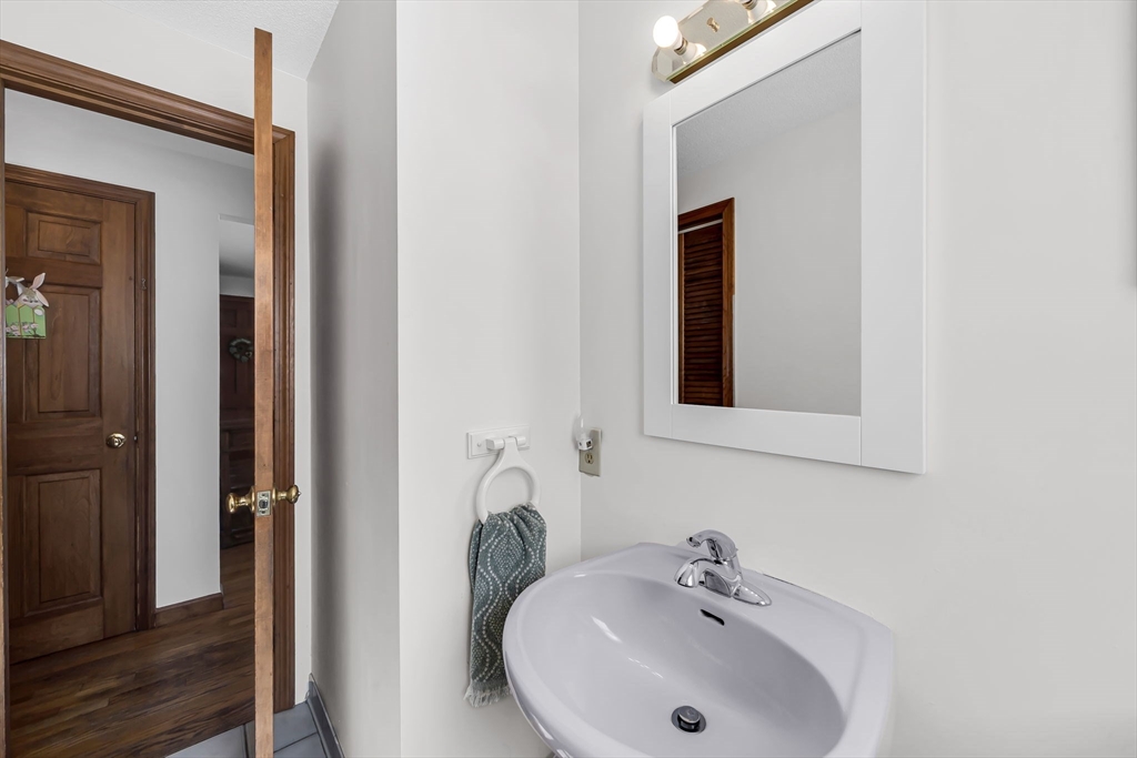 21 Martin Farms Road Hampden, MA 01036 - Photo 15 of 42 a bathroom with a sink and a mirror