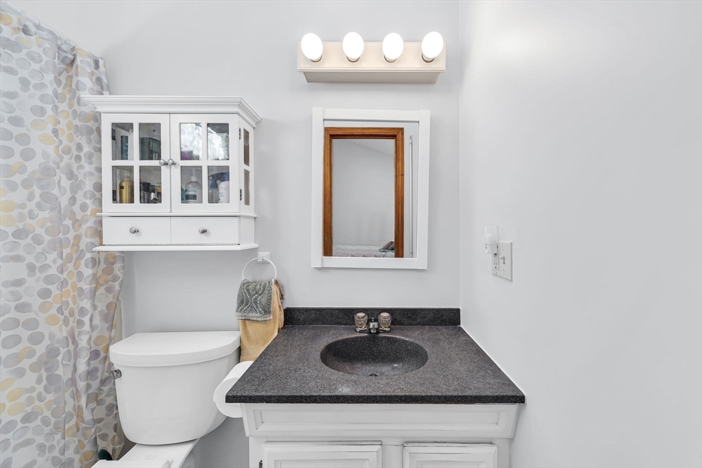 21 Martin Farms Road Hampden, MA 01036 - Photo 20 of 42 a bathroom with a sink and a mirror