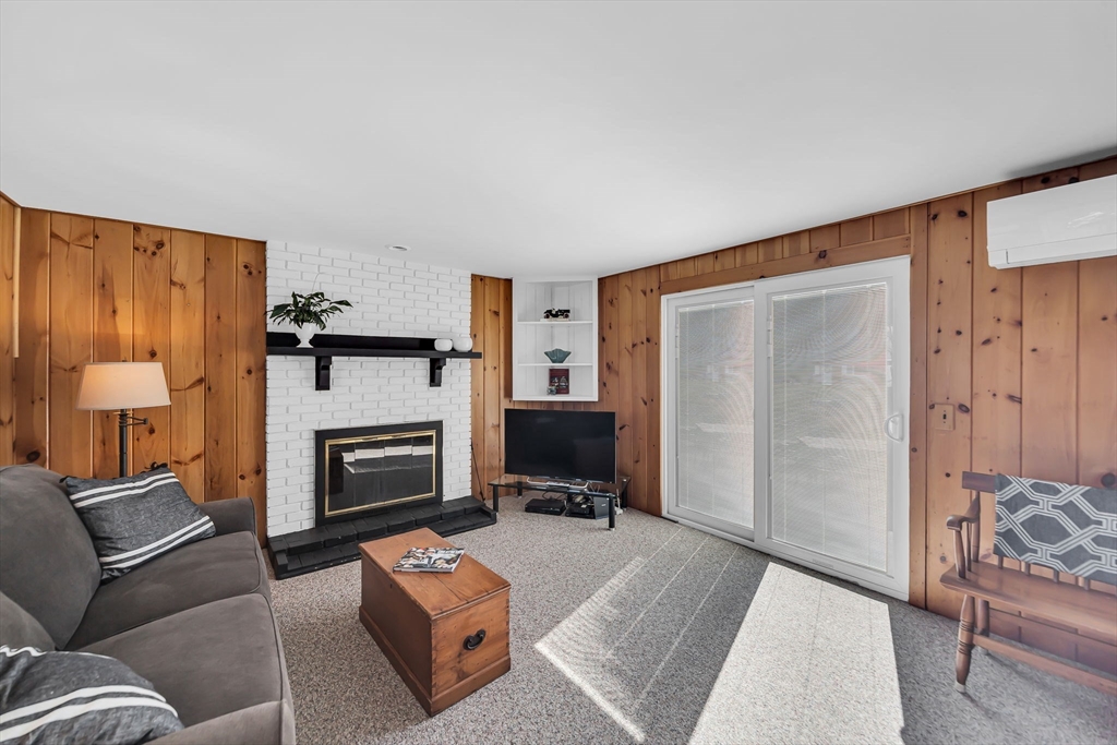 21 Martin Farms Road Hampden, MA 01036 - Photo 2 of 42 a living room with furniture and a fireplace