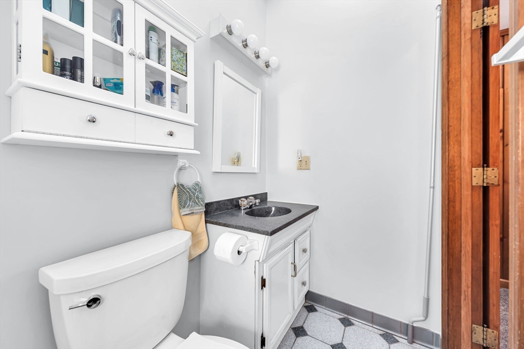 21 Martin Farms Road Hampden, MA 01036 - Photo 22 of 42 a bathroom with a granite countertop toilet and a sink
