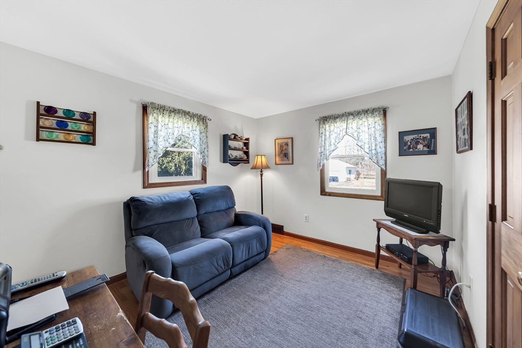 21 Martin Farms Road Hampden, MA 01036 - Photo 23 of 42 a living room with furniture a window and a flat screen tv