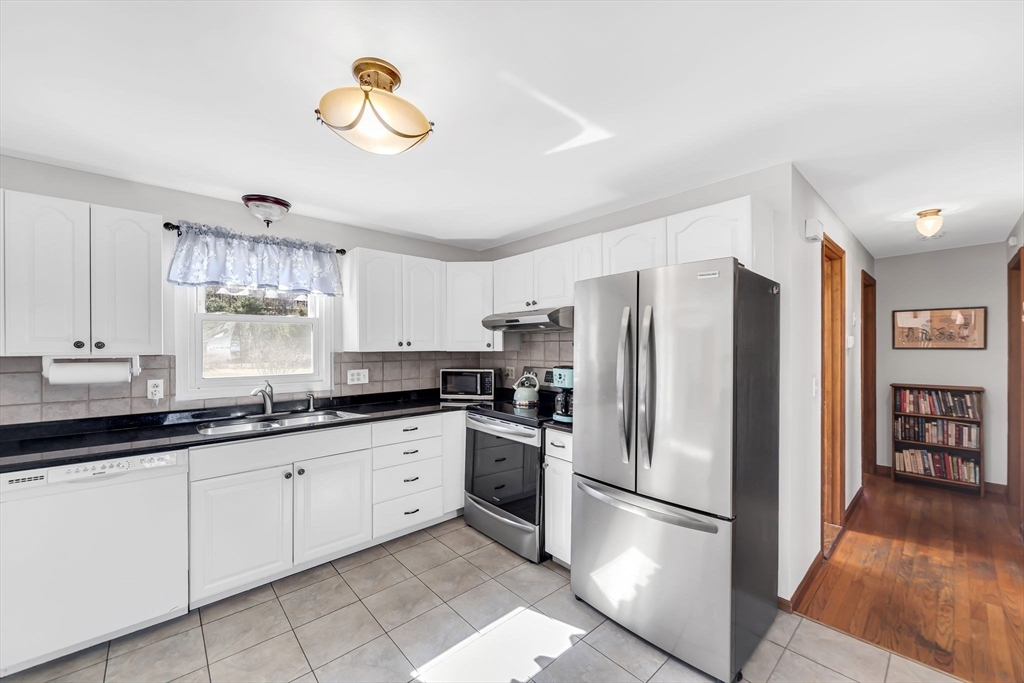 21 Martin Farms Road Hampden, MA 01036 - Photo 8 of 42 a kitchen with a refrigerator and a sink