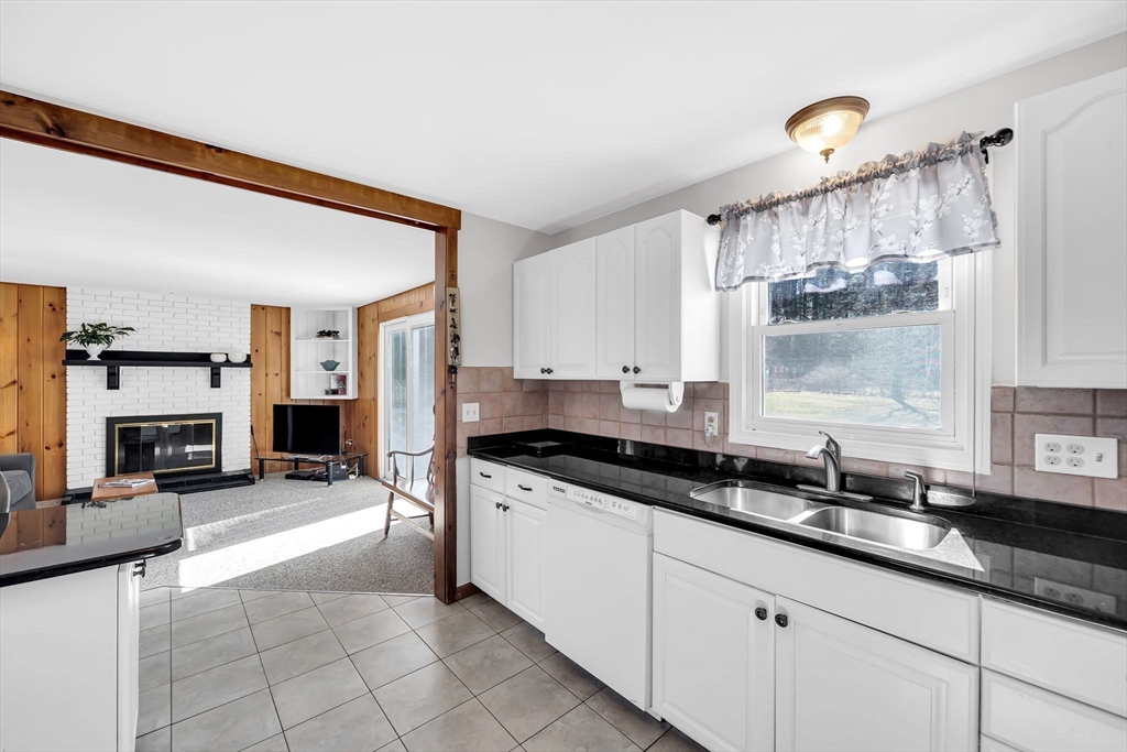 21 Martin Farms Road Hampden, MA 01036 - Photo 10 of 42 a kitchen with granite countertop a sink cabinets and window