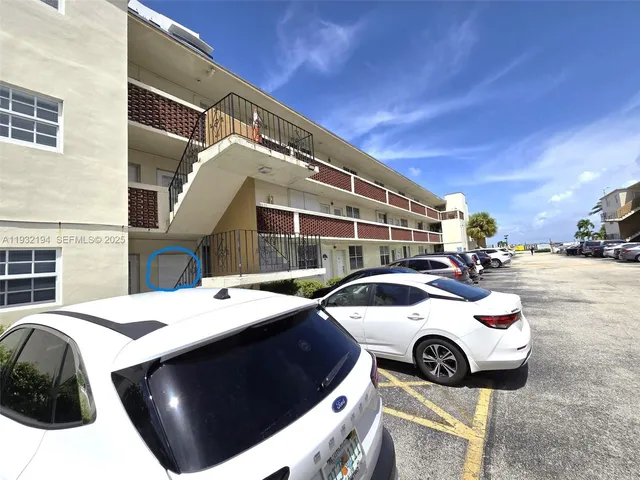 a view of a car garage with a car parked in it