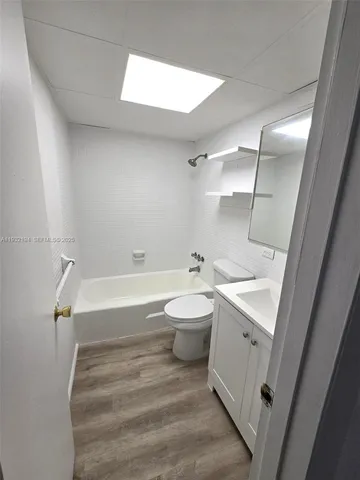 a bathroom with a sink a toilet and a bathtub