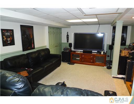 4 Halstead Road New Brunswick, NJ 08901 - Photo 11 of 17 a living room with furniture and a flat screen tv